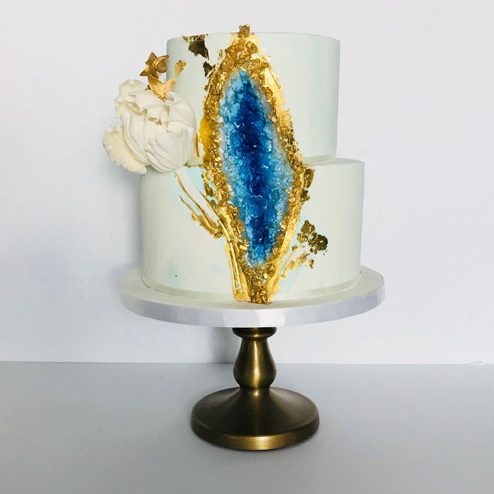 Geode inspired cake for a baptism. Decorated with gold leaf and sugar flowers