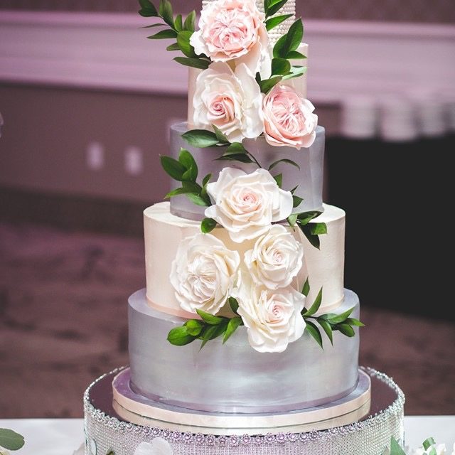 White And Green Tiered Custom Cake With Cascading Sugar Flowers 