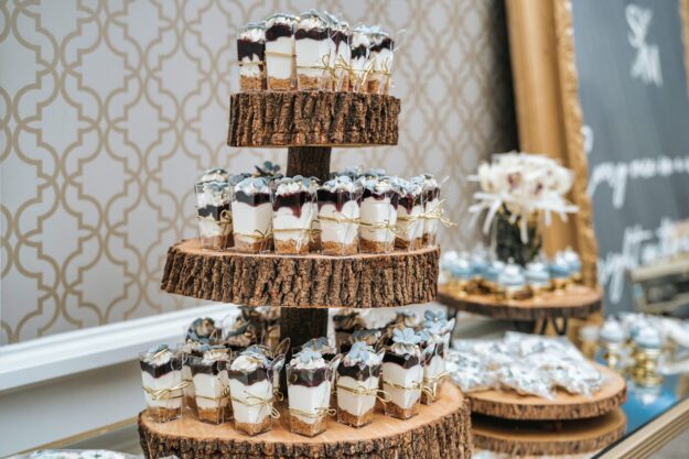 Cherry cherry cheese cake tumblers on a wooden tower, dusty blue accents.
